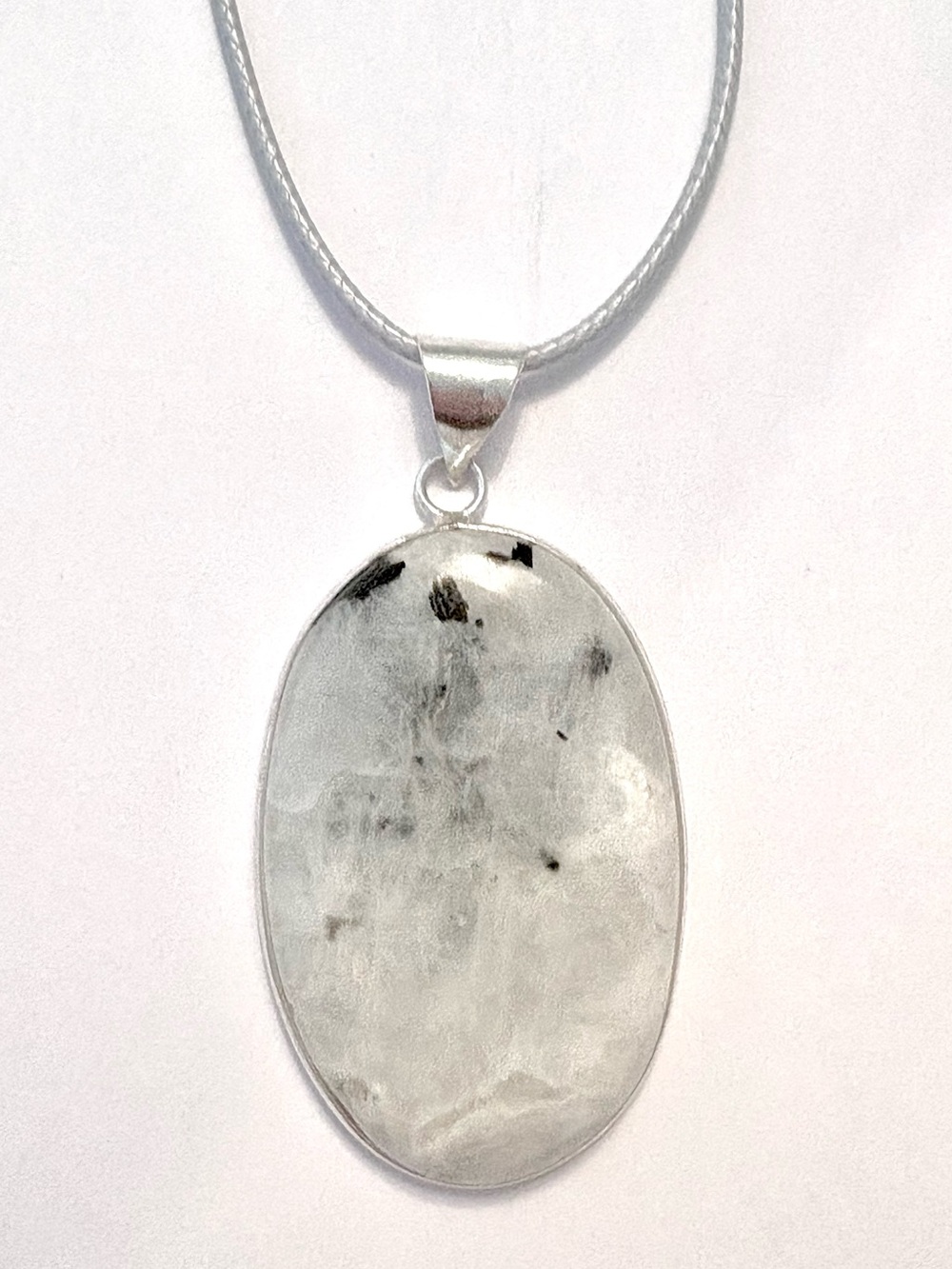 2 inch, Rainbow Moonstone, on a gray leather 20 inch, cord.